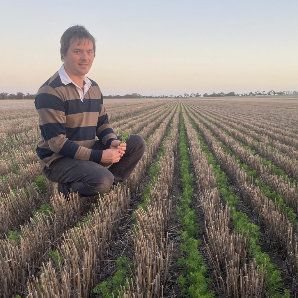 Matt Rohde inspecting soil and crops
